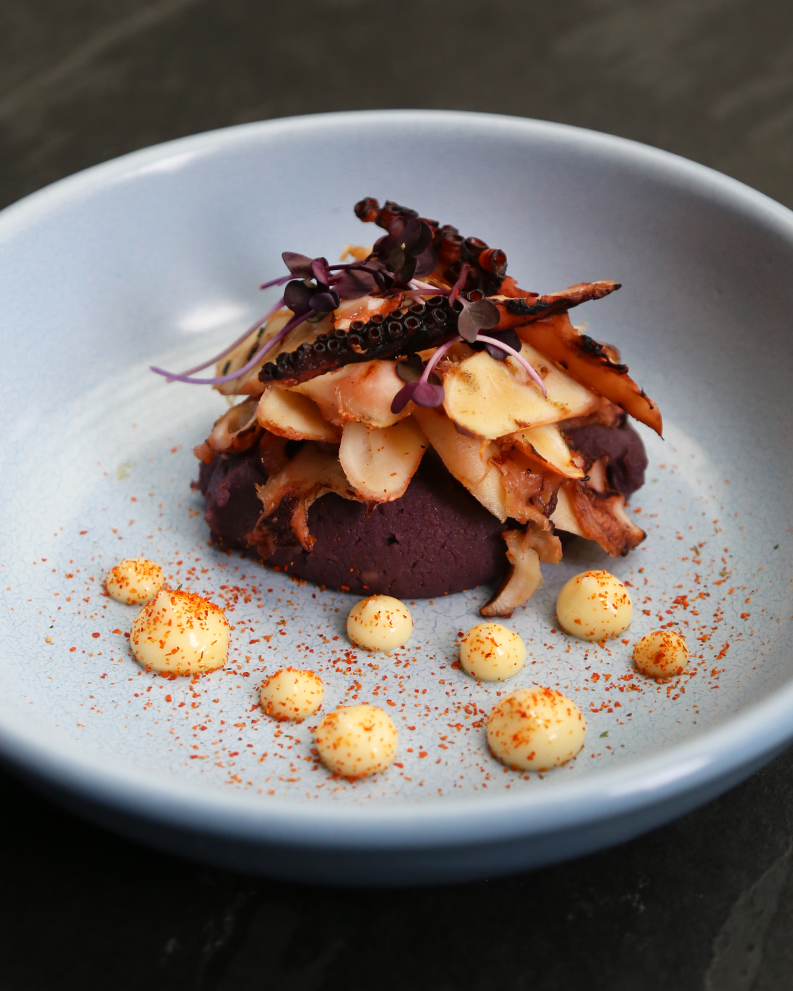 Grilled octopus with yuzu pepper soy, purple potato mash and shichimi pepper