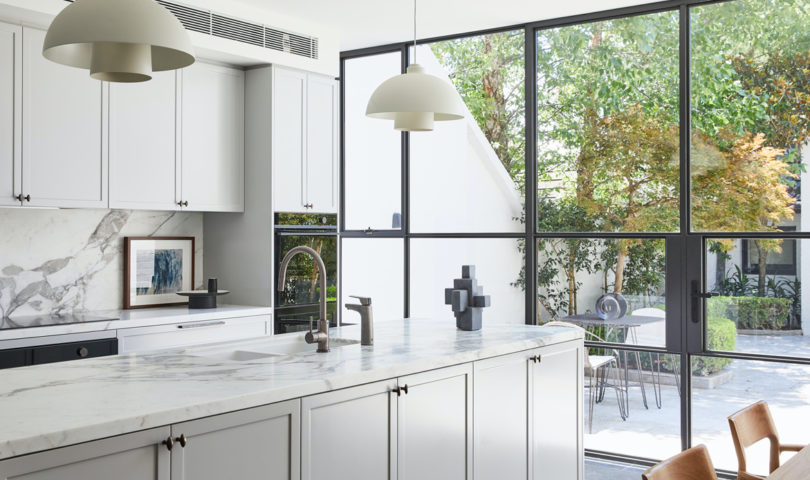 Sleek yet clever, this thoughtfully designed kitchen is the heart of this family home