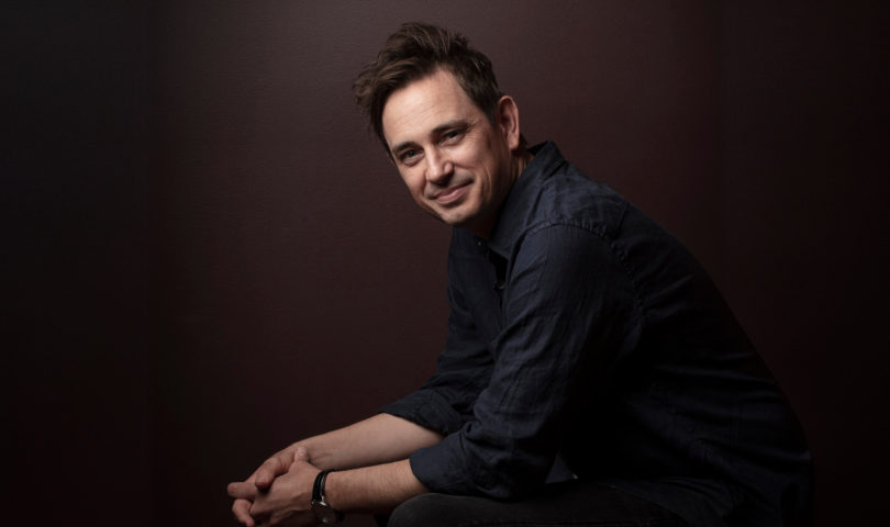 We talk to author Trent Dalton on his dark childhood, finding light between the cracks, and the girl who saved him