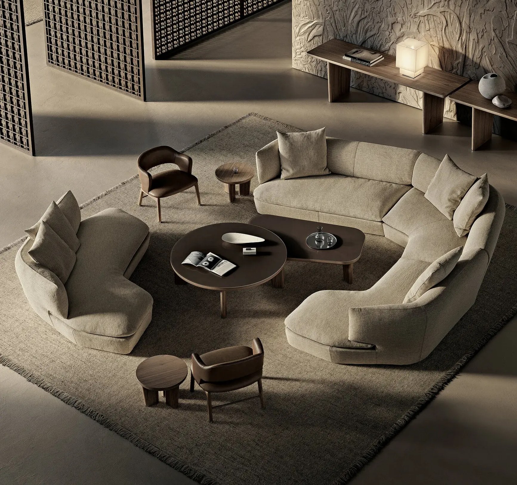 Aerial view of a curved sand-toned sectional sofa arrangement with walnut coffee tables in a luxury interior.